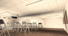 an empty room with folding chairs and a projector