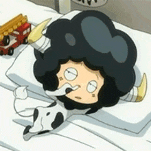 a cartoon character laying on a bed with a toy fire truck in the background