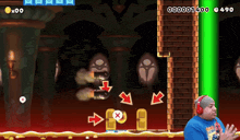 a man wearing headphones is playing a video game with a score of 14000