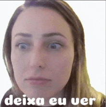 a close up of a woman 's face with the words deixa eu ver written below it