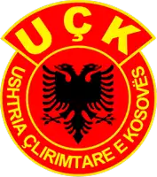 a red and yellow emblem with a black eagle and the words uck