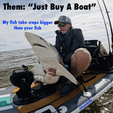 a man is holding a large shark on a boat and says " just buy a boat "