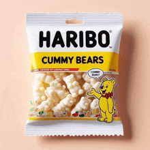 a bag of haribo gummy bears candy on a pink background