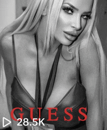 a black and white photo of a woman with guess 28.5k written in red