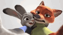 a fox and a rabbit from zootopia are hugging each other .