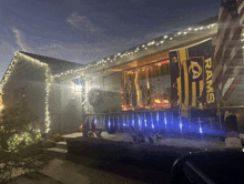 a house with a rams flag hanging on the porch