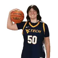a woman wearing a w tech jersey holds a spalding legacy basketball
