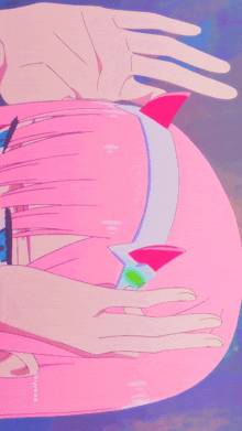 a close up of a person 's butt with a pink tail and a hand reaching for it