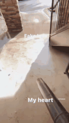 a vacuum cleaner is being used to clean a concrete floor with the words " my heart " written on it