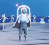 a person is standing on a beach in a video game with a cape on .