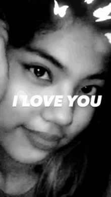 a black and white photo of a woman 's face with the words `` i love you '' .