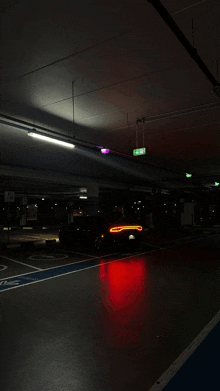 a car is parked in a parking garage with a handicapped parking space