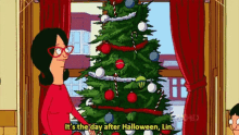 a cartoon of a woman standing in front of a christmas tree .