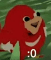 knuckles the echidna from sonic the hedgehog is smiling while standing on a green background .