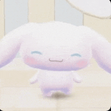 cinnamoroll is a cartoon character with big ears and a big smile on his face .