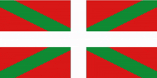 a red , green and white flag with a white cross in the middle .