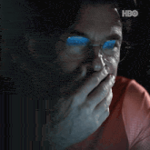 a close up of a man 's face with the hbo logo visible