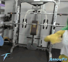 a picture of a gym with arrowfit on the bottom