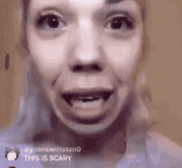 a close up of a woman 's face with the words this is scary on the bottom right corner .