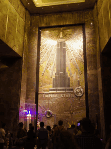 the empire state building is shown on a large wall