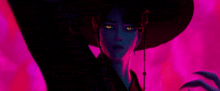 a woman in a black hat is standing in a dark room with a pink background .