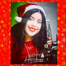 a woman wearing a santa hat is holding a bong in front of a happy holidays greeting card