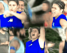 a woman wearing a blue kappa shirt is screaming in a crowd