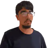 a pixelated image of a man wearing glasses and a brown shirt