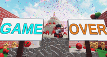 a game over sign is next to a cake with strawberries on it