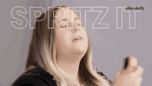 a woman with her eyes closed and the words " spritz it " above her