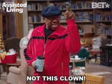 an advertisement for assisted living shows a man in a red jacket holding a cup and saying not this clown