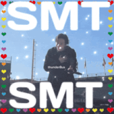a picture of a man with the words smt smt surrounded by hearts