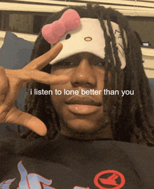 a man with dreadlocks wears a hello kitty headband