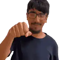 a man with glasses and a beard is pointing his finger