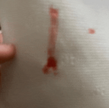 a close up of a person 's hand with blood on it