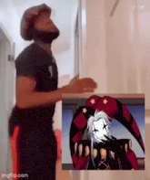 a man standing next to a picture of a jester with the time 0:06