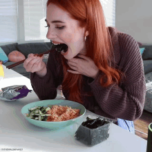 a woman with red hair is eating a bowl of food with chopsticks and the words itsthewalshfamily on the bottom