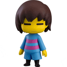 a yellow figure with brown hair and a blue shirt