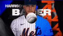 a baseball player for the mets is holding a baseball in his hand