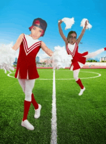 two cheerleaders are dancing on a soccer field with their faces on them .