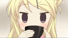 a blonde anime girl drinking from a small black cup