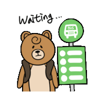 a teddy bear is waiting for a bus