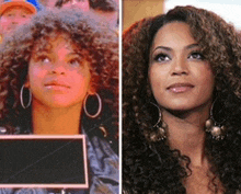 a woman with curly hair is holding a sign in front of a crowd of people