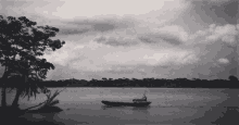 a black and white photo of a boat in the water