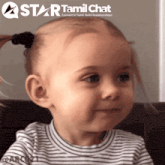 a little girl with a star tamil chat logo behind her