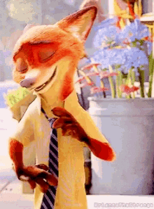 a fox wearing a yellow shirt and tie is standing in front of a potted plant .