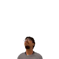 a man with a beard and glasses looks up at the number 16