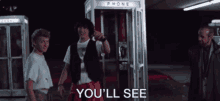 a phone booth with the words " you 'll see " on it