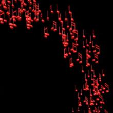 a bunch of red music notes are falling down on a black background .