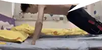 a man is doing push ups on a bed
